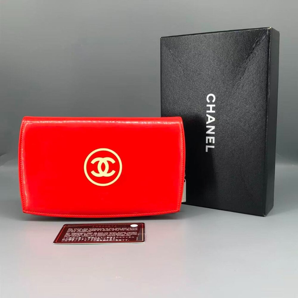 Authentic CHANEL Red Patent Leather CC Logo Wallet with Gold Emblem.